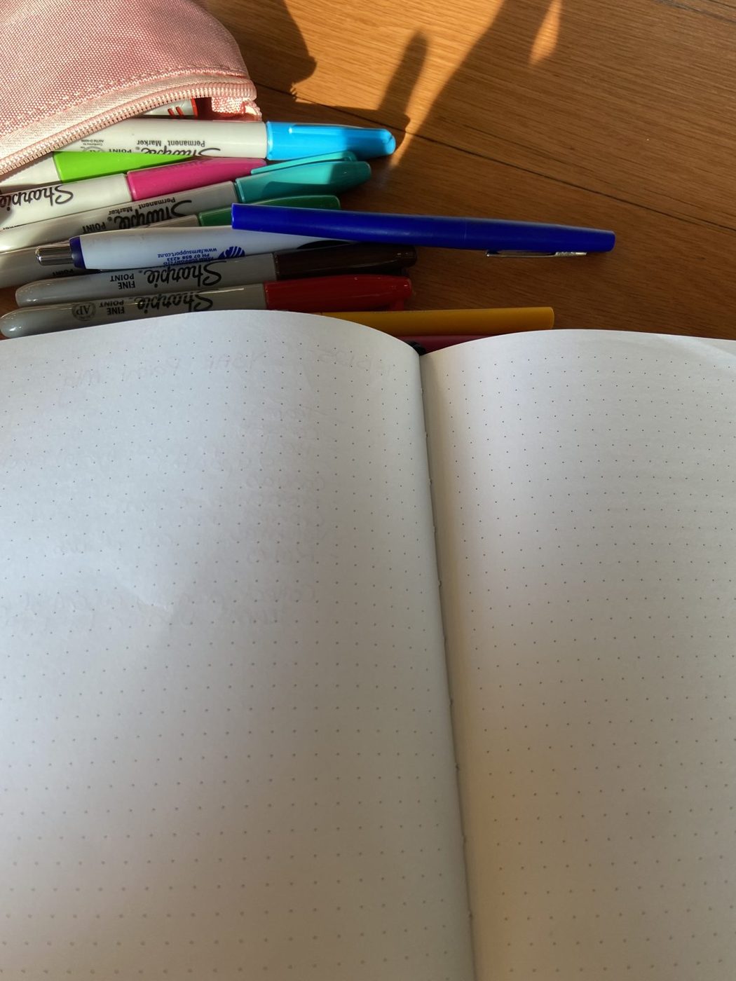 A blank page and pens, ready to start.