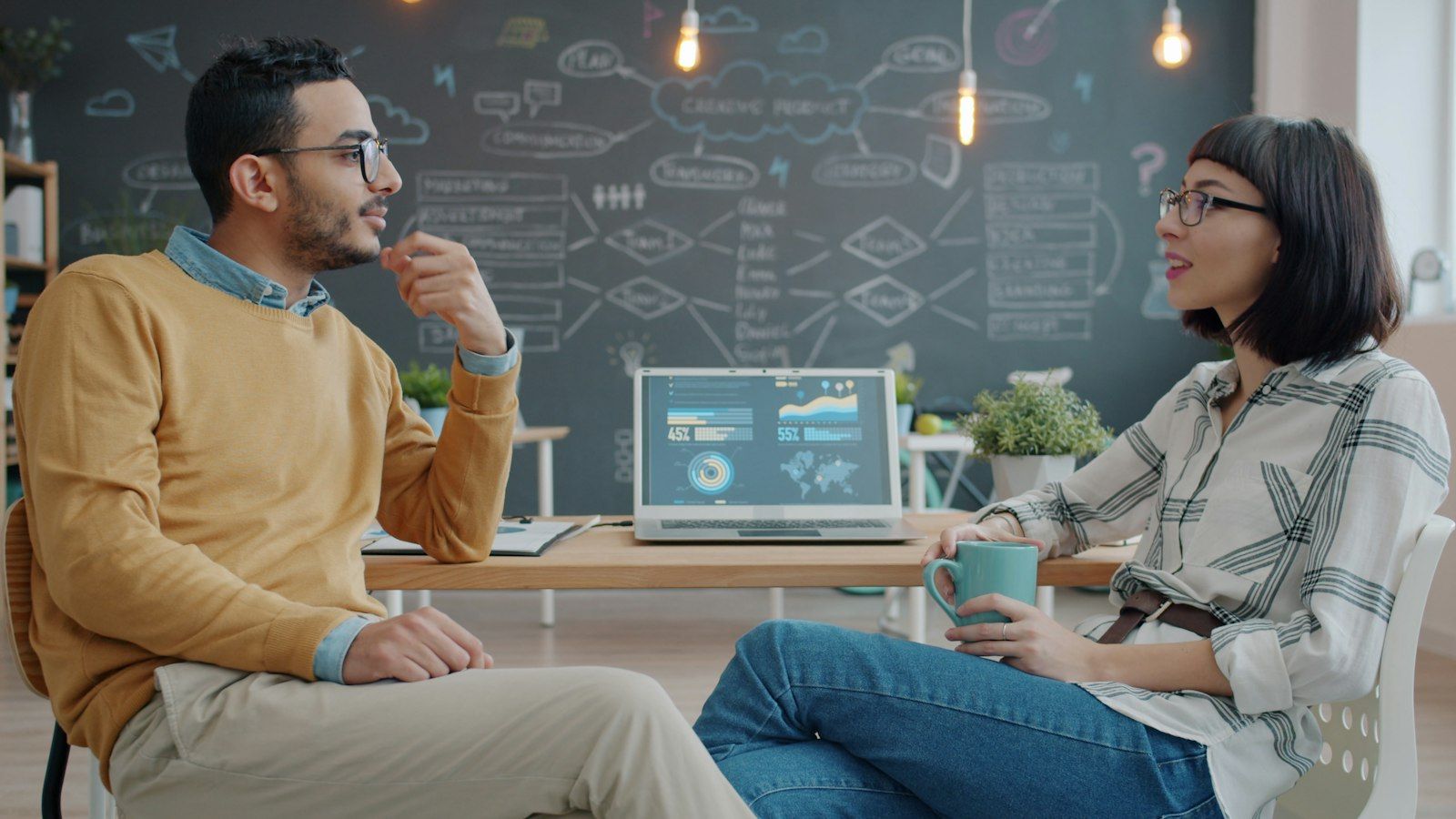 Two colleagues talking through an idea.