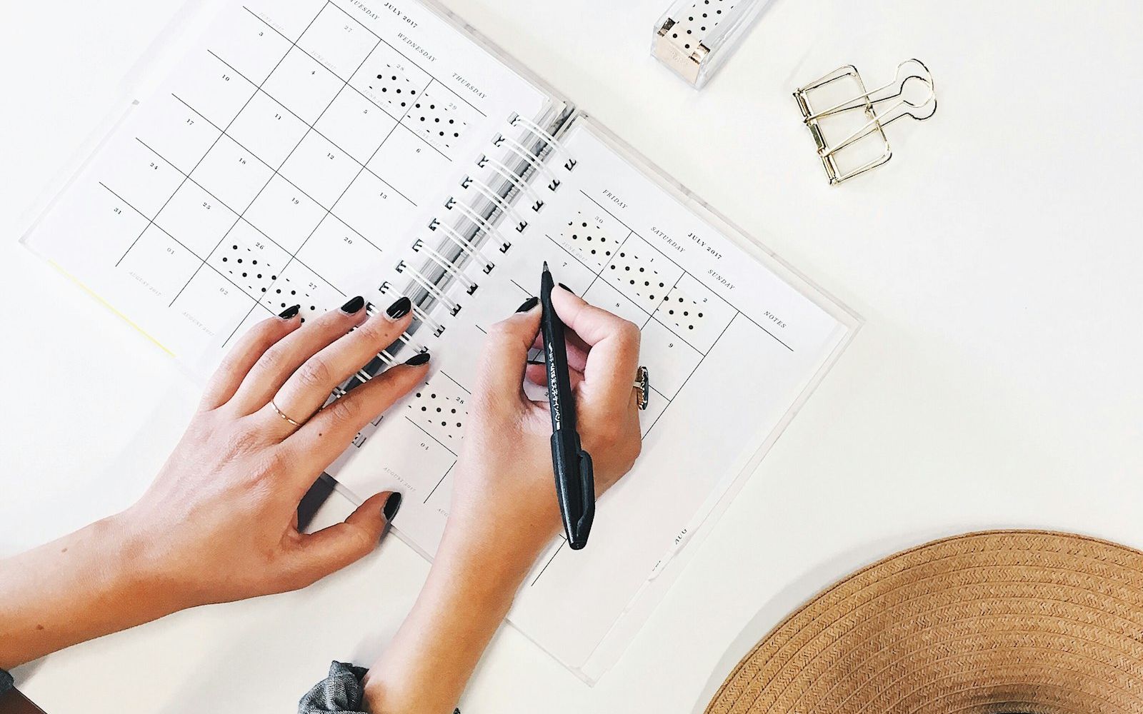 A hand writing with a ballpoint pen.