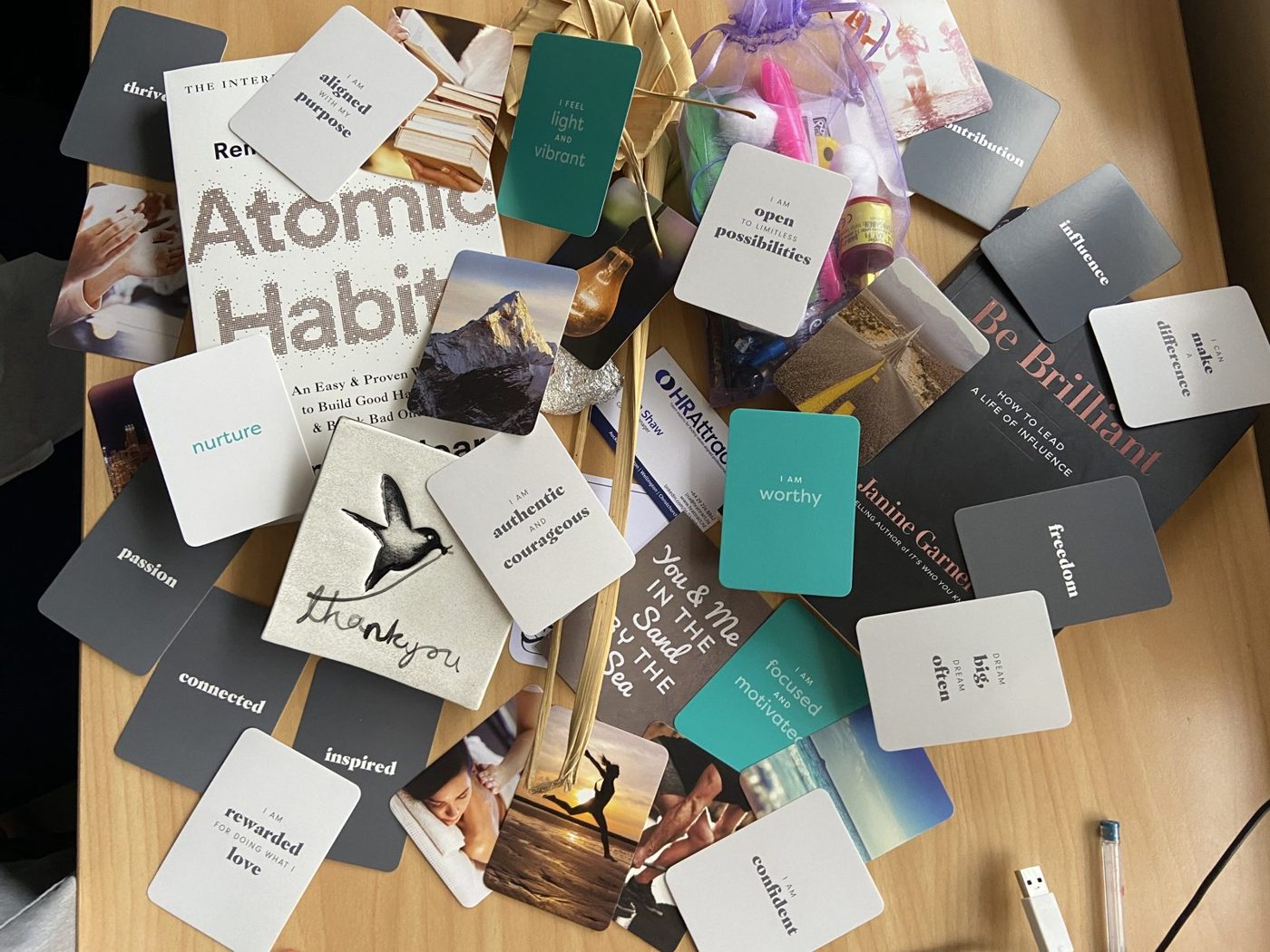 Workshop cards and books spread across a table.